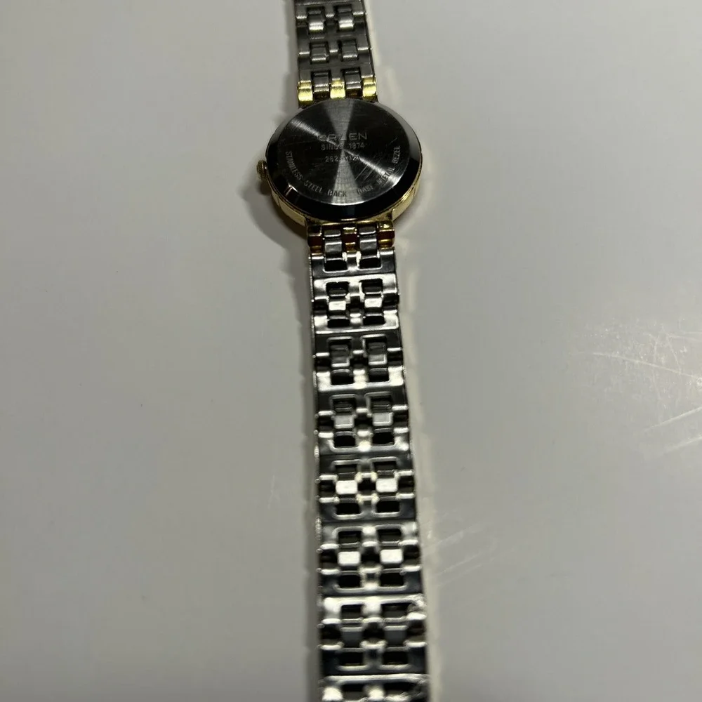 womens vtg 80s Gruden Gold Tone Watch Black Face Diamond Chip‎